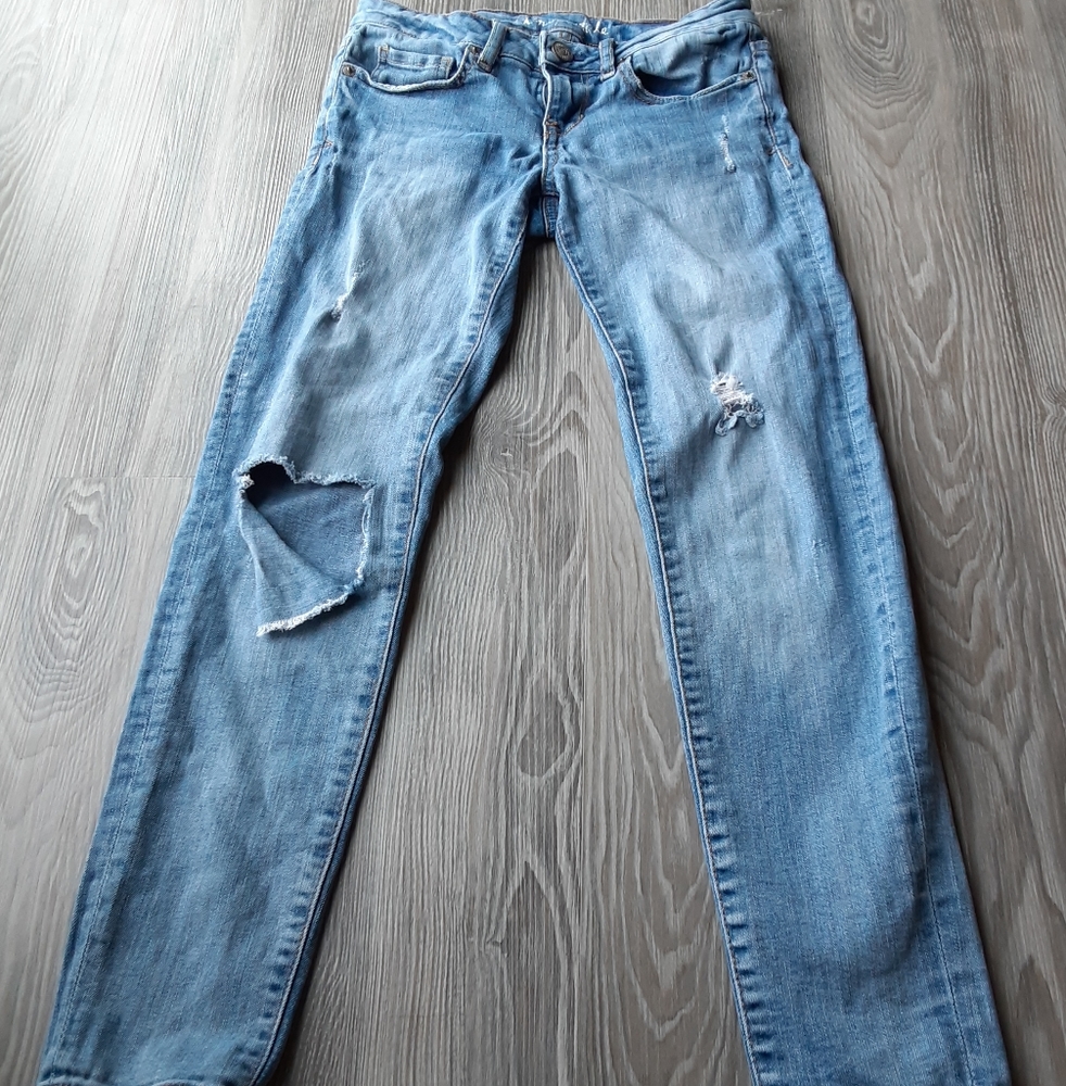 Distressed blue jeans